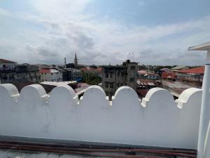 a view of a city from the roof of a building at Mango Apartment Hotel 芒果公寓酒店 in Zanzibar City +65 photos