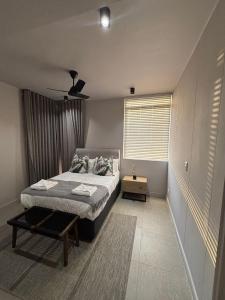 Ένα ή περισσότερα κρεβάτια σε δωμάτιο στο Zimbali Lakes Boulevard Edge 207