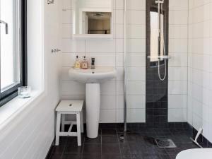 a white bathroom with a sink and a shower at 6 person holiday home in Kopparberg in Kopparberg