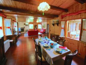 a dining room with a table and chairs at Chalet in Umbria with Private Pool in Città di Castello
