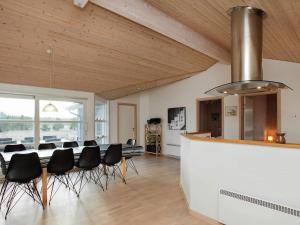 a dining room with a table and chairs at Luxury Retreat in Bratten - By Traum Ferienwohnungen in Jerup
