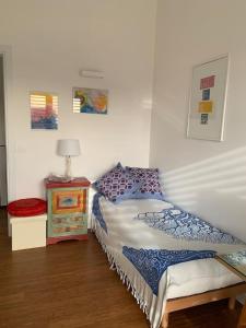 a bedroom with a bed and a table with a lamp at Lo Spazio dell'Anima 