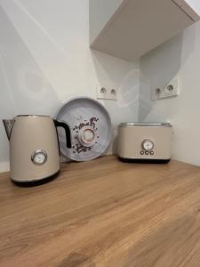 two toasters sitting on a wooden floor in a room at Casa Victoria in Ruelle-sur-Touvre +12 photos