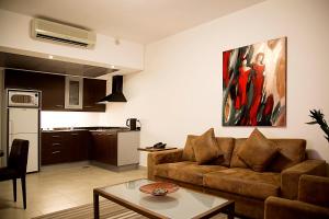 a living room with a couch and a table at Santona Residence in Beirut +39 photos