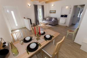 a kitchen and living room with a table and chairs at Summer Apartment in Makarska