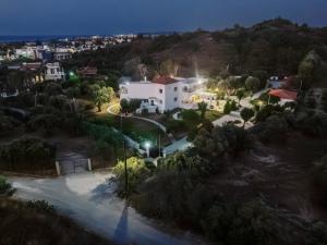 a view of a city at night at Adama Luxury Villa in Kremasti
