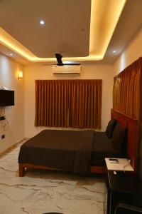 a bedroom with a bed and a window at Lillas White house in Arpora +20 photos