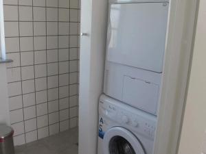 a washer and dryer in a small bathroom at 5 star holiday home in Nysted in Nysted +18 photos