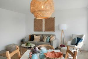 a living room with a couch and a table at Weitblick - in 5 min am Meer in Wangerland