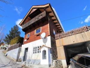 a house with a gambrel roof on a street at Chalet in Rangersdorf near Ski Slopes in Rangersdorf