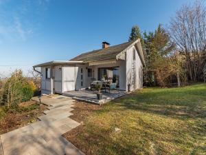 a small white house with a patio in the yard at Garden Comfort in Rieder, Harz in Ballenstedt