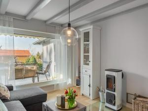 a living room with a couch and a tv at Garden Comfort in Rieder, Harz in Ballenstedt
