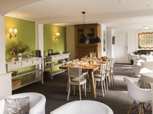 a dining room with a table and chairs at Ferienhaus mit Sauna in Winterberg in Winterberg