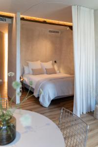 a bedroom with a large bed with a canopy at Enea Living in Bilbao