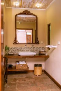 a bathroom with a sink and a mirror at Aga Surf View in Tangalle +105 photos