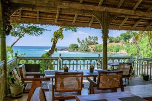 a restaurant with a view of the ocean at Aga Surf View in Tangalle