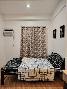 Postel nebo postele na pokoji v ubytování Magoncia Condo Feel at Home and Enjoy Vacation