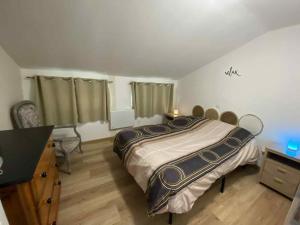 Ένα ή περισσότερα κρεβάτια σε δωμάτιο στο La petite bulle