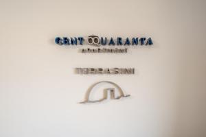 a sign for anant quantumarma department at thettenham courtham court building at Centoquaranta Apartment in Terrasini