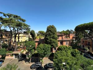 a view of a town with cars parked in a parking lot at Penthouse Luxe - Rome in Rome