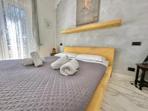 a bedroom with two beds with pillows at Penthouse Luxe - Rome in Rome