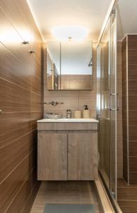 a bathroom with a sink and a shower at Central Thessaloniki Boutique in Thessaloniki +46 photos