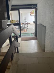 a view of a hallway with a table and chairs at Pension De Lux Rain in Rain