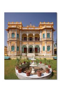 a large building with a fountain in front of it at Koolwal Kothi Zinc Journey by The Fern, Nawalgarh, Rajasthan in Nawalgarh +41 photos