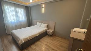 Ένα ή περισσότερα κρεβάτια σε δωμάτιο στο Ada Residence Buca