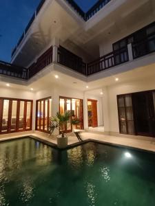 an indoor swimming pool in a villa at Artha Sadia Villa 2 Seseh Beach in Cemagi