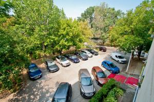 a group of cars parked in a parking lot at Central Aparthotel in Galaţi
