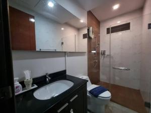 a bathroom with a sink and a toilet and a shower at ChinJu PoolVilla in Jomtien Beach +54 photos