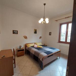 Ένα ή περισσότερα κρεβάτια σε δωμάτιο στο La Casa di Rina