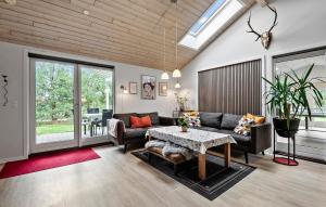 a living room with a couch and a table at Lovely Home In Ansager With Wifi in Ansager
