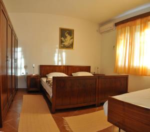 A bed or beds in a room at Apartments Miana