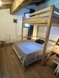 a bedroom with a wooden bunk bed in a room at Les 7 laux immobilier chalet F in Prapoutel +242 photos