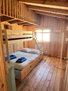 a bedroom with two bunk beds in a cabin at Lisbon Beach Hut - Costa Caparica in Costa da Caparica +49 photos