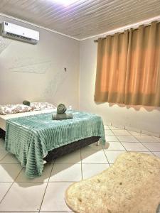 En eller flere senge i et værelse på Casa para Eventos e Festas de fim de Ano