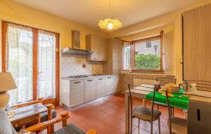 a kitchen with a table and a counter top at Pet Friendly Apartment in Monte Santa Maria Tiberina