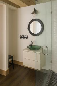 a bathroom with a sink and a mirror at E&S Lake House Retreate & S Lake House Retreat in Amherstburg
