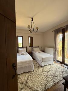 Ένα ή περισσότερα κρεβάτια σε δωμάτιο στο Vytina Mont et Sapin