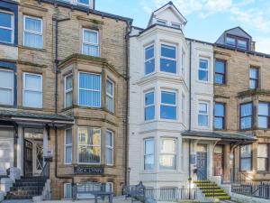 an apartment building on the corner of a street at Sand Dune - Uk48699 in Lancaster +4 photos