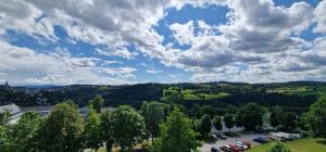 an aerial view of a parking lot with trees and clouds at Stadtblick Annaberg Große Fewo Peter 5 Personen in Annaberg-Buchholz