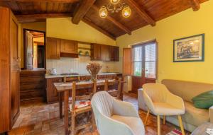 a kitchen and living room with a table and chairs at Nice Home In Monte Smaria Tiberina in Monte Santa Maria Tiberina