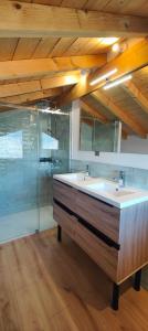a bathroom with a large tub and a glass shower at Chalet recent , 5 min télésiège de la Roche, virage 12 in La Plagne Tarentaise