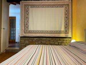 Giường trong phòng chung tại Appartamento in Villa a Pinamare