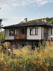 a house sitting on top of a hill at Къщата на музиканта in Leshten