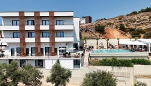 an aerial view of a hotel with a pool at Cayo Exclusive Hotel in Vlorë