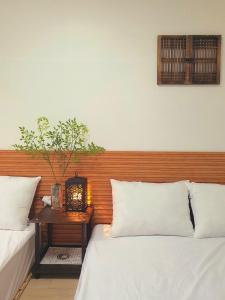 Postel nebo postele na pokoji v ubytování J&J Garden Stay Suncheon Bay National Garden Fair