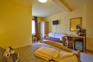 Ένα ή περισσότερα κρεβάτια σε δωμάτιο στο Pergola Rooms